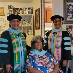 Dr. Brandy, her Dr. twin, and Dr. mom all smiling together
