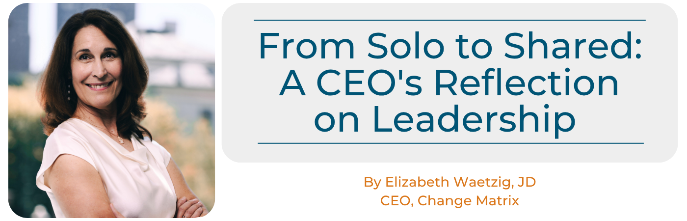 A promotional graphic displays the title "From Solo to Shared: A CEO's Reflection on Leadership" in large teal text inside a light grey box. Below the title, orange text identifies the author as "By Elizabeth Waetzig, JD CEO, Change Matrix." To the left, a professional headshot shows Elizabeth Waetzig smiling warmly with her arms crossed, wearing a white top.