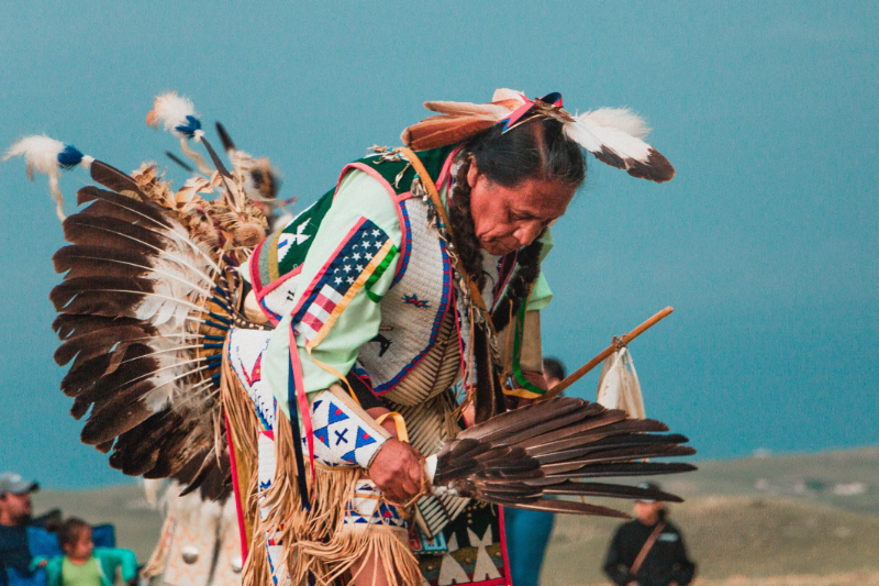 Lakota Native American Man at Pow Wow. Photo by Andrew James via Unsplash.