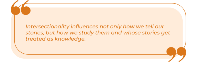 A graphic quote set on a light peach background, framed by an orange border line and large, stylized quotation marks at the corners. The text is presented in an orange, italicized serif font and reads verbatim: "Intersectionality influences not only how we tell our stories, but how we study them and whose stories get treated as knowledge."
