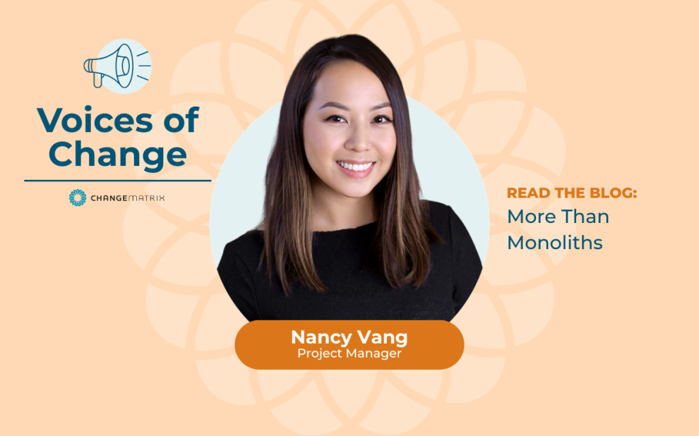 A promotional graphic for Change Matrix's 'Voices of Change' blog series on a warm peach background with a subtle floral watermark pattern. On the left, a megaphone icon appears above the bold navy text 'Voices of Change' with the Change Matrix logo beneath it. In the center, Nancy Vang is shown in a circular portrait frame, smiling and wearing a black top, with her name and title 'Project Manager' displayed in a burnt orange banner below her photo. To the right, text reads 'READ THE BLOG: More Than Monoliths,' inviting viewers to engage with her featured article.